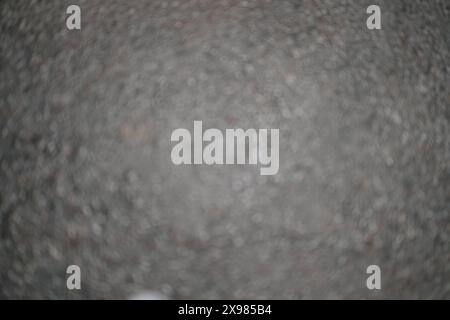Abstract blurry background of dark asphalt texture. Stock Photo