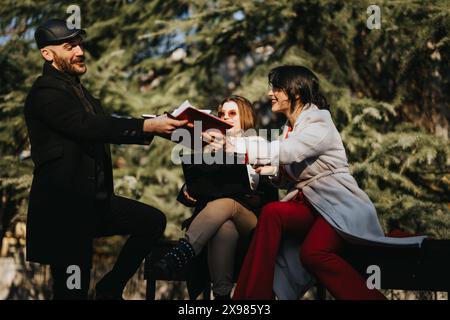 Multicultural business team strategizing outdoors in urban setting. Stock Photo