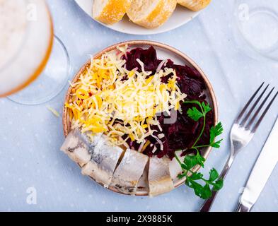 Beetroot served with cheese and pickled mackerel Stock Photo