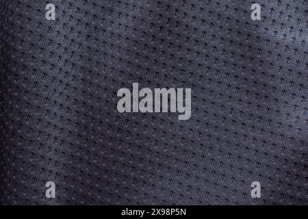Black fabric sport clothing football jersey with air mesh texture background Stock Photo