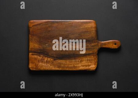 Top view of cutting board on dark gray background Stock Photo