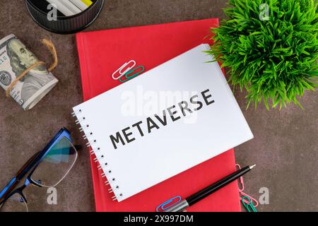 New Decentralized Internet - Smart Contract and Crypto Currency. Metaverse word on a blank sheet of notepad next to the business supplies Stock Photo