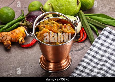 Indian traditional cuisine Aloo mutter - potato with green peas Stock Photo