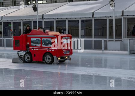 Machine and driver preparing ice rink at Somerset House Stock Photo