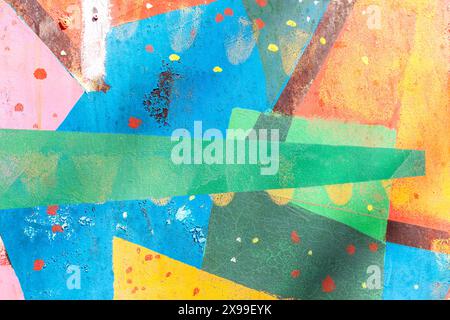 Abstract multicolored background of metal surface covered with rust and paints. Old sheet of iron with colored paints and corrosion as creative textur Stock Photo