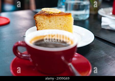 Black Americano Coffee and Lemon Cake on Side Stock Photo