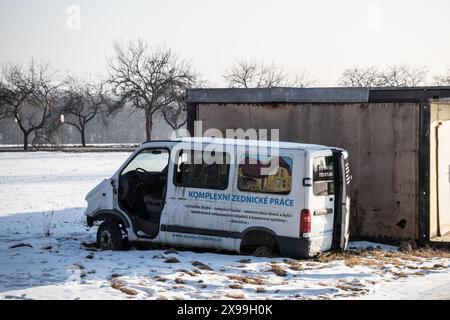 PROSTREDNI SUCHA, CZECH REPUBLIC - JANUARY 28, 2017: Damaged Renault Traffic white van abandoned near garages polluting the surroundings of Prostredni Stock Photo