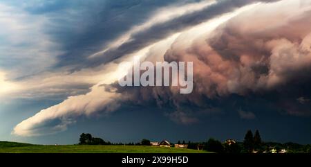 Shelf storm clouds with intense tropic rain over village Stock Photo