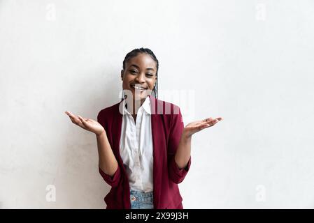 Portrait of happy successful confident African American businesswoman. Beautiful young lady in formalwear smiling standing and looking at camera. Busi Stock Photo