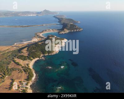 A breathtaking aerial capture of Voidokilia Beach and the adjacent coastline, showcasing the pristine waters and natural beauty of the region under th Stock Photo