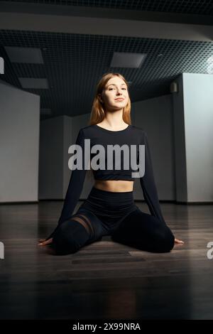 Choreographer practicing floorwork moves in choreographic studio Stock Photo