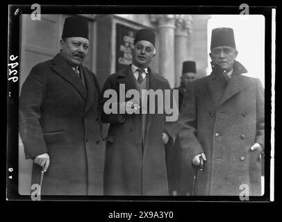 Members of the Arab Higher Committee, leaving the offices of the Royal Commission on 12 January 1937 after their first appearance to give evidence.  L-R: Dr. Husein Khaldi, Mayor of Jerusalem, Ruhi Bey Abdul-Hadi, senior government official, Ragheb Bey Nashashibi, President of the Defence Party. Stock Photo