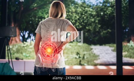 VFX Back Pain Augmented Reality Render. Close Up of a Female Experiencing Discomfort in a Result of Spine Trauma or Arthritis. Massaging and Stretching the Back to Ease the Injury. Stock Photo