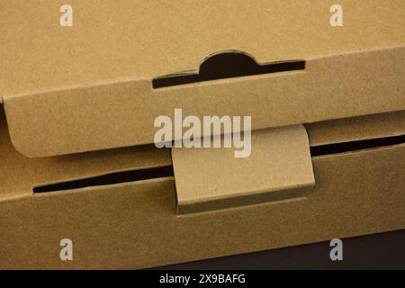 A close-up shot of a clasp on a cardboard box cover Stock Photo