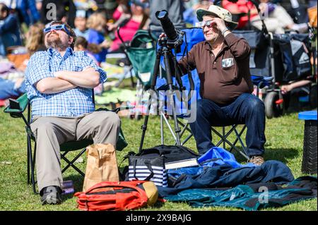 Viewers watch the solar eclipse of 2024 from the lawn of the Vermont State House, Montpelier, Vermont, USA, April 8, 2024. Stock Photo