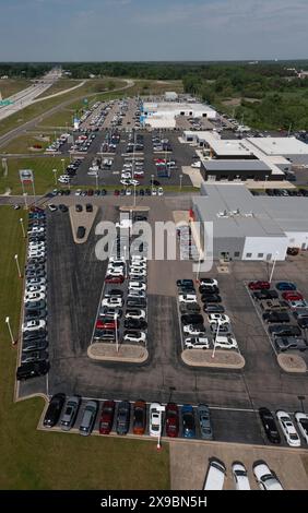 Jackson, Michigan - New car dealers along Interstate 94. From bottom: Nissan, Chrysler, Honda, and Chevrolet vehicles on sale. Stock Photo