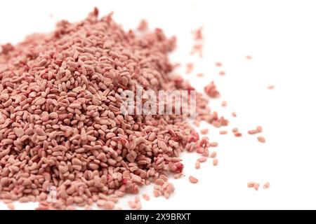 Pile of Red Raspberry Seeds Isolated on a White Background Stock Photo
