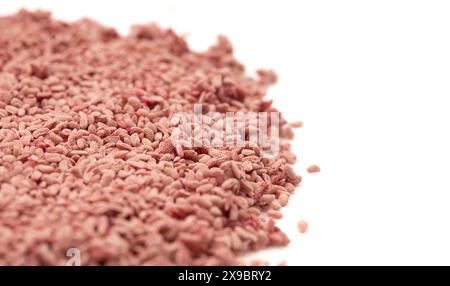 Pile of Red Raspberry Seeds Isolated on a White Background Stock Photo