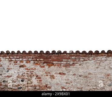 Old boundary wall with plaster and peeling background with exposed brick and roof tile as frame border isolated on white with clipping path included, Stock Photo