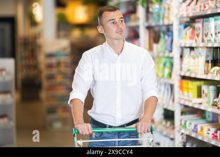 A shopper browses goods at a supermarket in Huai'an, east China's ...