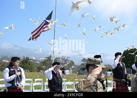 May 27, 2024 - Vandenberg Space Force Base, California, USA - A flock of doves soar across the Santa Barbara Cemetery during the Santa Barbara Memorial Day Ceremony in Santa Barbara, Calif., May 27, 2024. Team Vandenberg leadership and members participated in Memorial Day ceremonies alongside community members in Lompoc, Santa Maria, Solvang, Guadalupe and Santa Barbara. Each paid tribute to the fallen heroes who made the ultimate sacrifice in the service and defense of our nation. (Credit Image: © U.S. Space Force/ZUMA Press Wire) EDITORIAL USAGE ONLY! Not for Commercial USAGE! Stock Photo