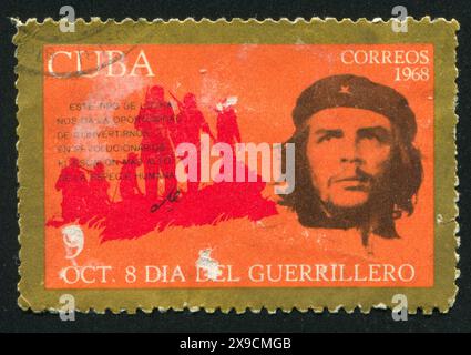 CUBA - CIRCA 1968: stamp printed by Cuba, shows Che Guevara and silhouette of battalion, circa 1968 Stock Photo