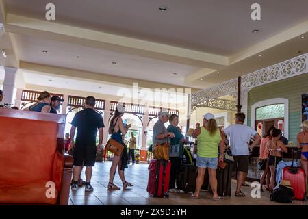 17 FEB 2016, Cuba - Tourists at the reception desk, checking in at a holiday resort Stock Photo