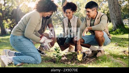 Teamwork, planting and community project in nature, park and garden for sustainable environment. Group work, climate change and happy volunteers with Stock Photo