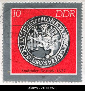 GERMANY - CIRCA 1986: stamp printed by Germany, shows Rostock coin, circa 1986 Stock Photo