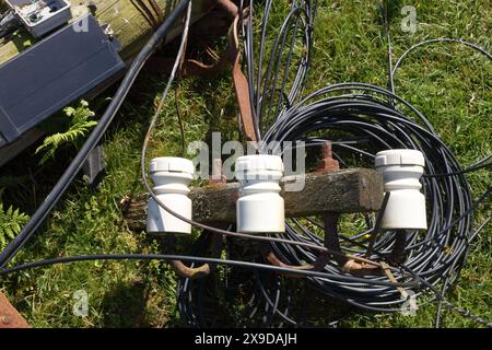 A roadside casualty of a driving accident with a heavy vehicle having hit a telegraph pole and snapped it knocking the top part over. Stock Photo