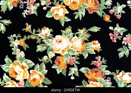 Retro rose on black color fabric background. Stock Photo