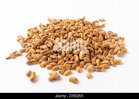 Roasted kamut on white background Stock Photo