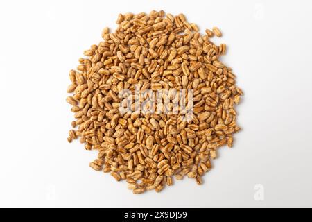Roasted kamut on white background Stock Photo