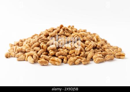 Roasted kamut on white background Stock Photo