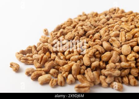 Roasted kamut on white background Stock Photo