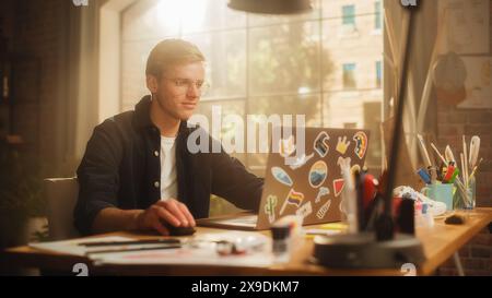 Concentrated Man Designs Video Game on His Powerful Laptop Computer in a Creative Office Space. Man Looking at Screen, Creating Digital Clothing and Footwear for Metaverse. Stock Photo