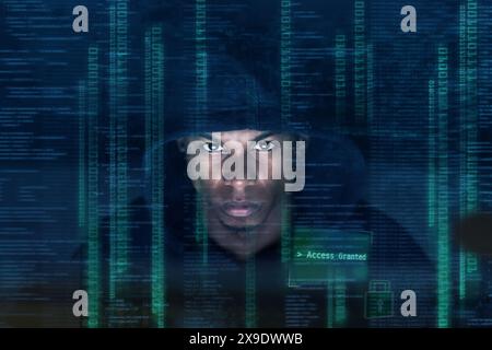Night, hacker and black man with code for information technology, firewall breach or programming. Overlay, cybersecurity and male person in dark for Stock Photo