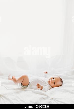 Happy Baby Boy in front of Sunny Window Stock Photo