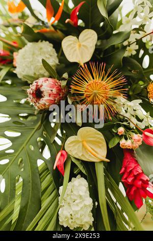 Tropical Hawaiian flower arrangement with proteas and orchids Stock Photo