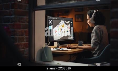 View From Outside The Window in the Apartment: Female Footwear Designer Creating and Rendering 3d Model of Shoe and Working on Powerful Desktop Computer. Shoe Production Procedure Concept. Stock Photo