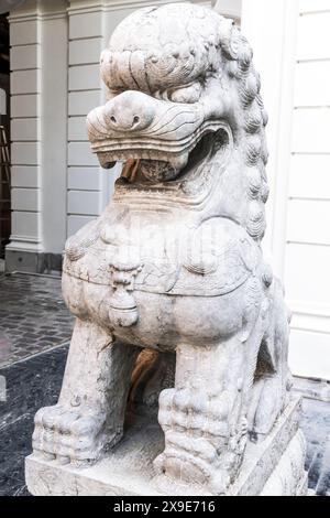 Stone guard lion statue at Gangaramaya Temple, the most important temples in Colombo, Sri Lanka Stock Photo