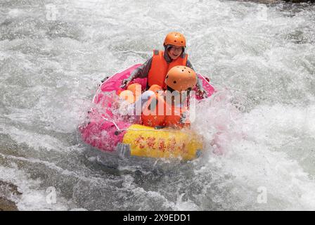 Tourists experience rafting in Yichang City, central China's Hubei ...
