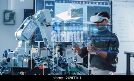 Computer Science Engineer in Virtual Reality Headset Using Controllers and Operating Robot Arm Under his Control. VFX Augmented Reality Interfaces and Icons Demonstrate Innovative Technologies. Stock Photo