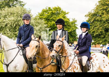 SHEPTON MALLET, SOMERSET, UK, 31st May, 2024, Winners of the Mounted Team Relay, 'Staff College Draghunt'  at The Royal Bath and West Show Credit John Rose/Alamy Live News Stock Photo