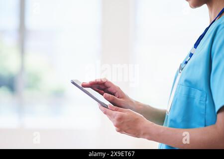 Healthcare Professional Using Digital Tablet in Hospital Setting Stock Photo