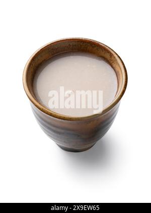 Single cup of Japanese kuro Amazake, fermented rice drink close up ...