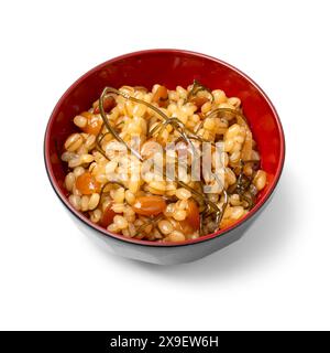 Bowl with Japanese Natto Miso close up isolated on white background Stock Photo