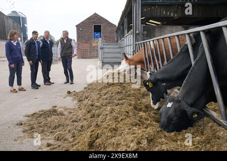 David Rutley (left to right) Farm owner Mike Rowlinson, Prime Minister Rishi Sunak ...
