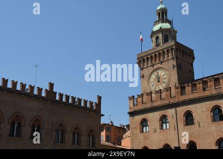 Piazza Maggiore is the heart of Bologna with the marbles of the basilica of San Petronio, Palazzo d'Accursio, Palazzo  Podestà, the Neptune fountain Stock Photo