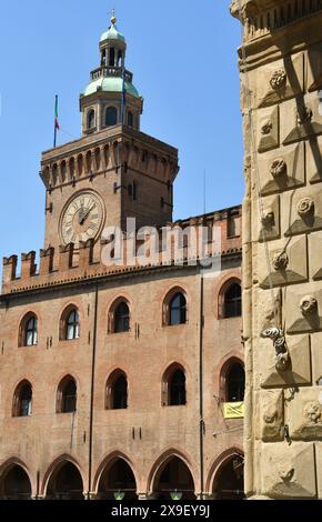 Piazza Maggiore is the heart of Bologna with the marbles of the basilica of San Petronio, Palazzo d'Accursio, Palazzo  Podestà, the Neptune fountain Stock Photo